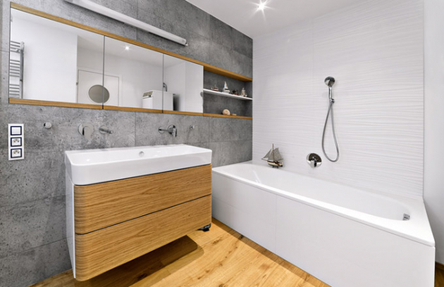 Stěny jsou obložené velkoformátovými obklady Porcelanosa. U umyvadla Green (Catalano) jsou podmítkové baterie Via Baqutta (Gessi) Stěny jsou obložené velkoformátovými obklady Porcelanosa. U umyvadla Green (Catalano) jsou podmítkové baterie Via Baqutta (Gessi)