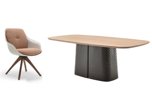 Jídelní stůl Rolf Benz 929 je složen z organicky tvarované desky z přírodního kamene nebo masivního dřeva a ocelové základny s hladkou povrchovou úpravou s perforovaným vzorem.