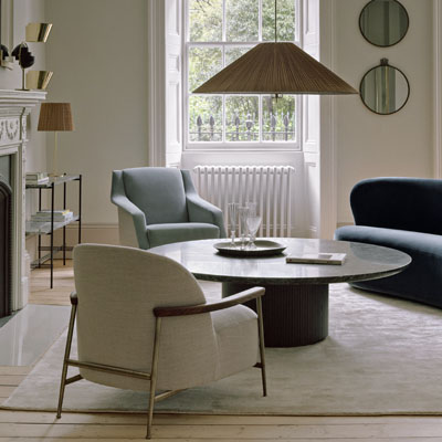 Křeslo CDC.1 Lounge Chair, design Carlo de Carli, dřevo i ocel, textilie i kůže, cena  od 65 531 Kč, křeslo Sejour Lounge Chair, design GamFratesi, masivní dřevo, textilie i kůže, cena od 73 396 Kč