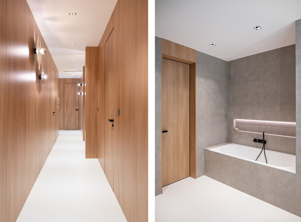 Dveře MASTER ve skryt&eacute; z&aacute;rubni a obkladu EFEKTA vytv&aacute;řej&iacute; jednu rovinu. V koupelně je patrn&aacute; souhra dřevodekoru a kamenn&yacute;ch povrchů. Pov&scaron;imněte si sjednocen&eacute; podlahy.